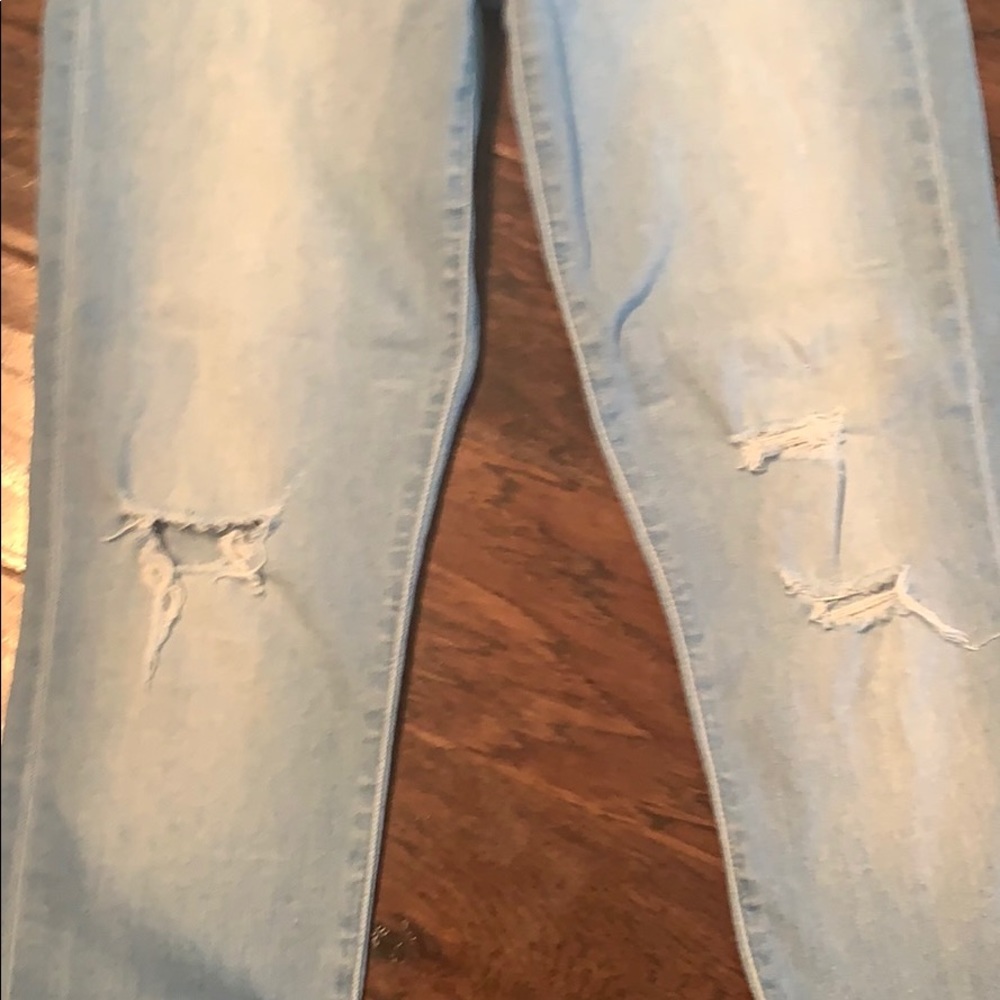 Barely worn light-denim skinny jeans with holes. - Picture 3 of 6